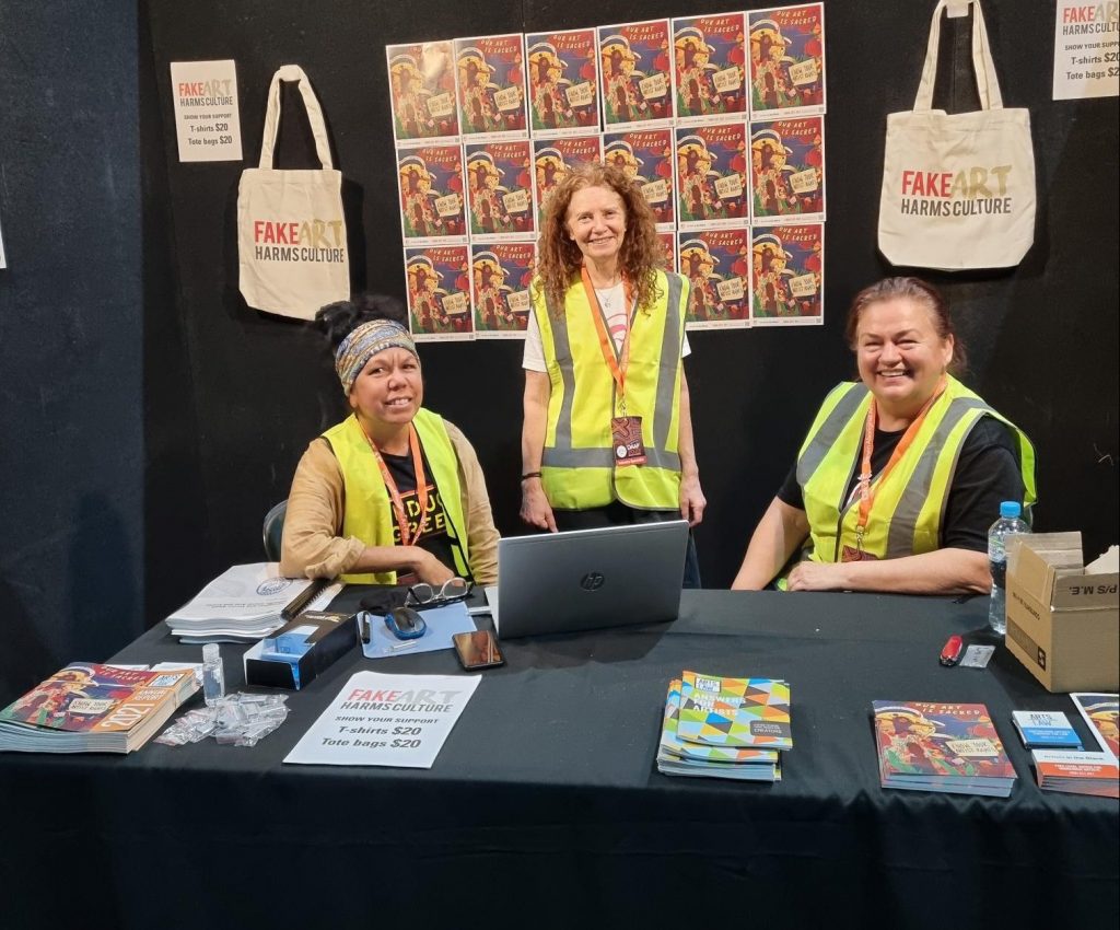 The Arts Law stall at DAAF 2022. From left to right, Jo-Anne Driessens (AITB Coordinator), Robyn Ayres (former CEO), and Donna Robinson (Director of AITB Legal). Photo by Andrew Leslie. DAAF celebrates Aboriginal art and culture, including fashion design.