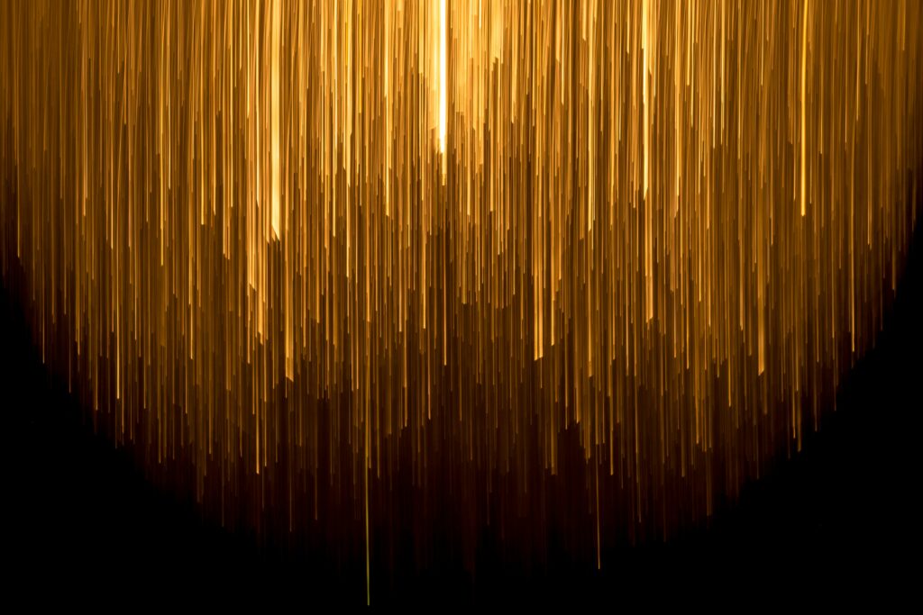 A photo of gold strands, emphasising the potential money artists can earn.