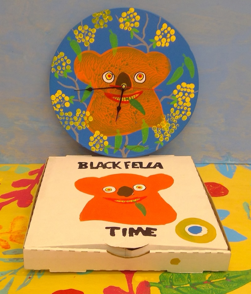 image of koala artwork on clock face and a box with a painted koala and the words Black Fella Time painted on it