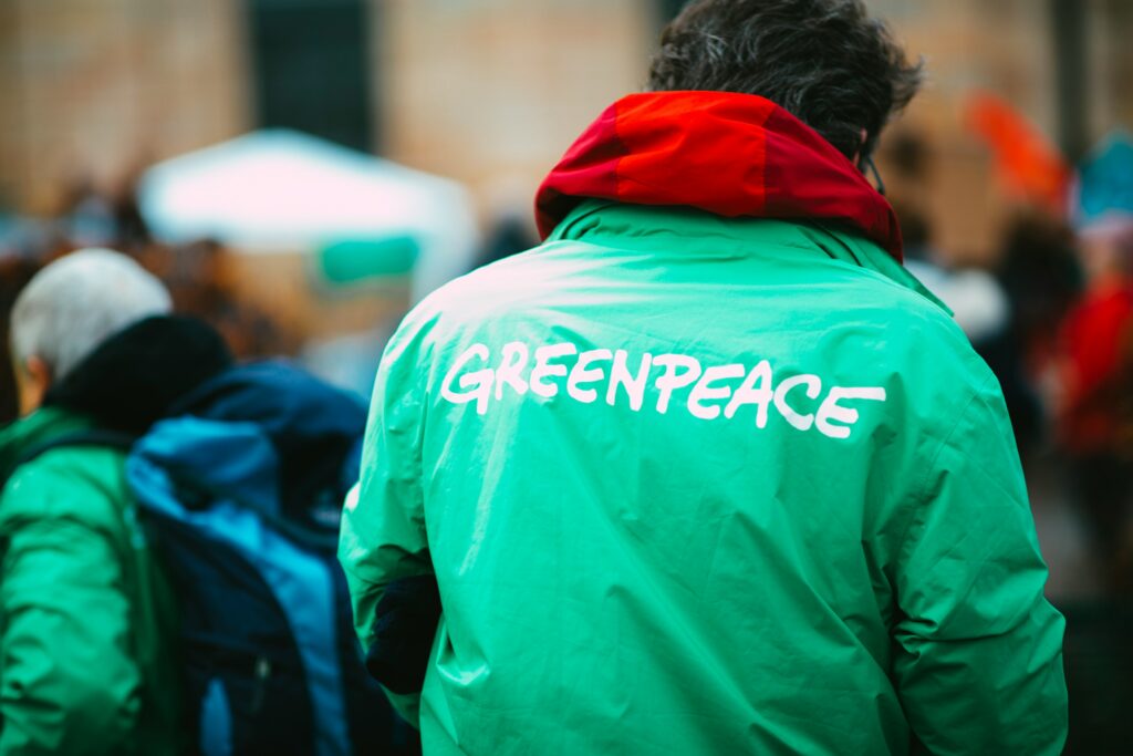 man in green hoodie walking